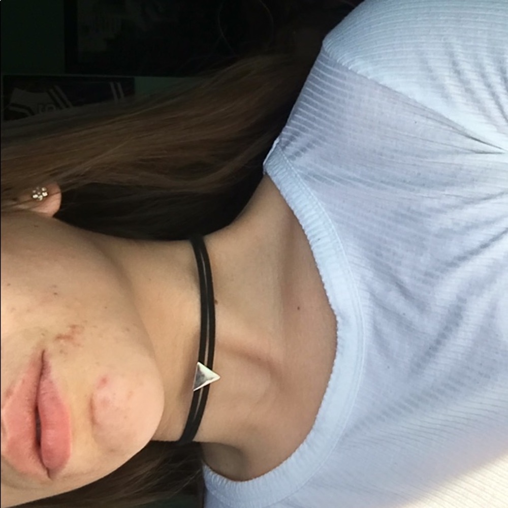 Silver triangle on black choker